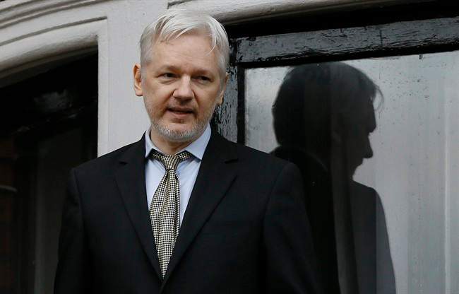WikiLeaks founder Julian Assange speaks from the balcony of the Ecuadorean Embassy in London. 