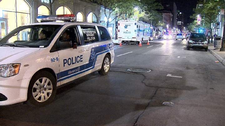 Pollice investigate after a man was stabbed in downtown Montreal. Wednesday, May 24, 2017.