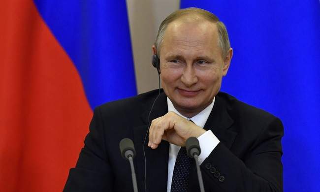 Russian President Vladimir Putin listens to a question at a joint news conference with Italian Prime Minister Paolo Gentiloni at the Bocharov Ruchei state residence in Russian Black Sea resort of Sochi on Wednesday, May 17, 2017.