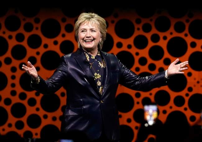 Former Secretary of State Hillary Clinton gestures while speaking before the Professional Businesswomen of California in San Francisco.