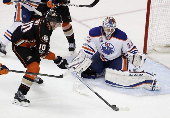 Anaheim Ducks right wing Corey Perry, left, scores the game winning goal past Edmonton Oilers goalie Cam Talbot during the fifth period in overtime in Game 5 of a second-round NHL hockey Stanley Cup playoff series in Anaheim, Calif., Friday, May 5, 2017.