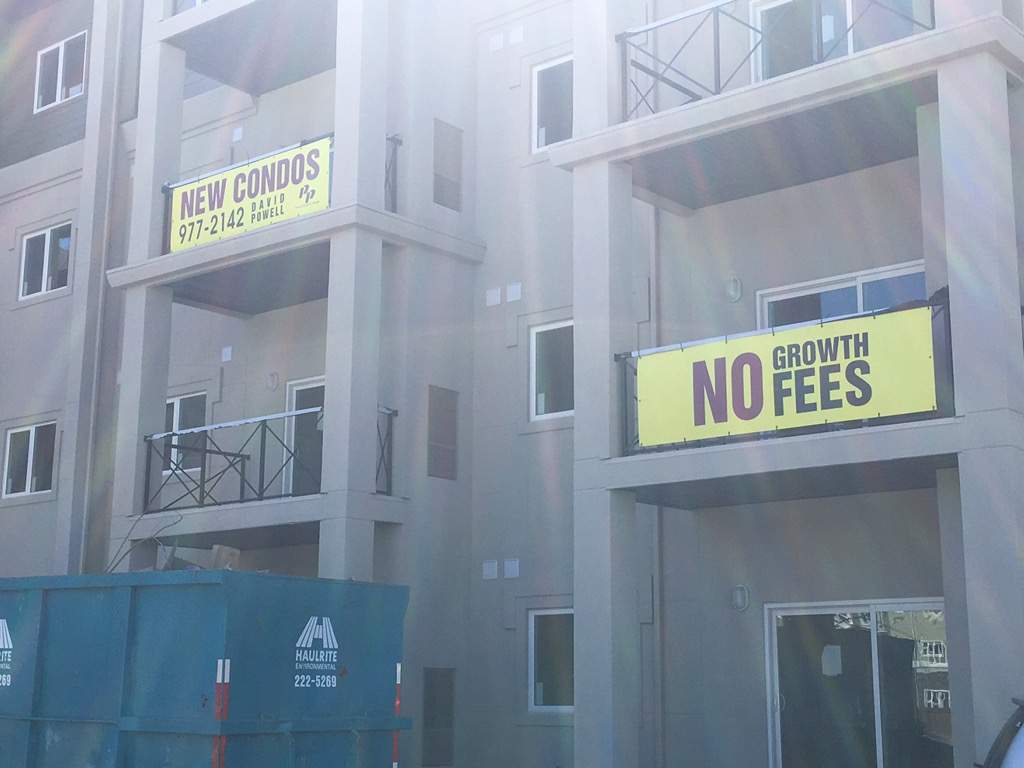 Advertising for no growth fees around the city.