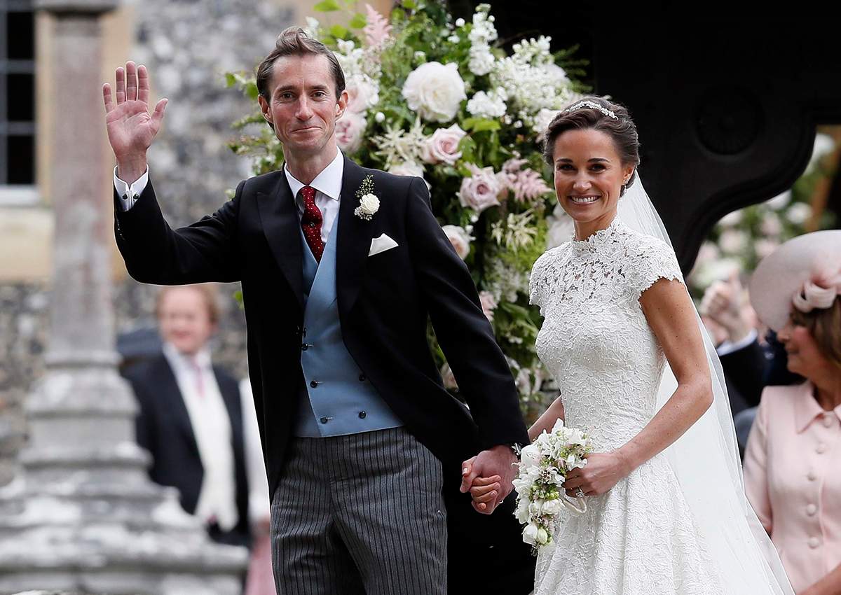 Pippa Middleton and James Matthews smile for the cameras after their wedding at St Mark’s Church in Englefield, England Saturday, May 20, 2017.