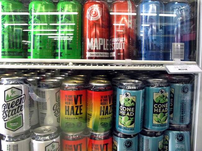 Different varieties of Vermont craft beer sit in a store cooler at Mehuron's Market on Tuesday, May 9, 2017,.