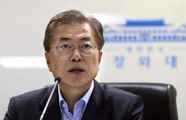 South Korean President Moon Jae-in speaks as he presides over a meeting of the National Security Council at the presidential Blue House in Seoul, South Korea.
