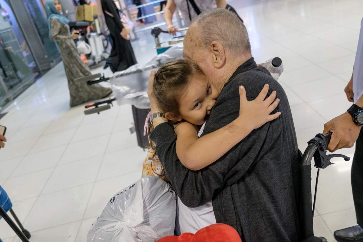 Gordon Norwood hugs his great-granddaughter Katherine.