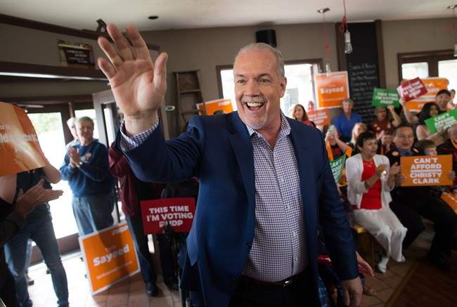 NDP Leader John Horgan waves during a campaign stop in Penticton, B.C., on Saturday May 6, 2017.