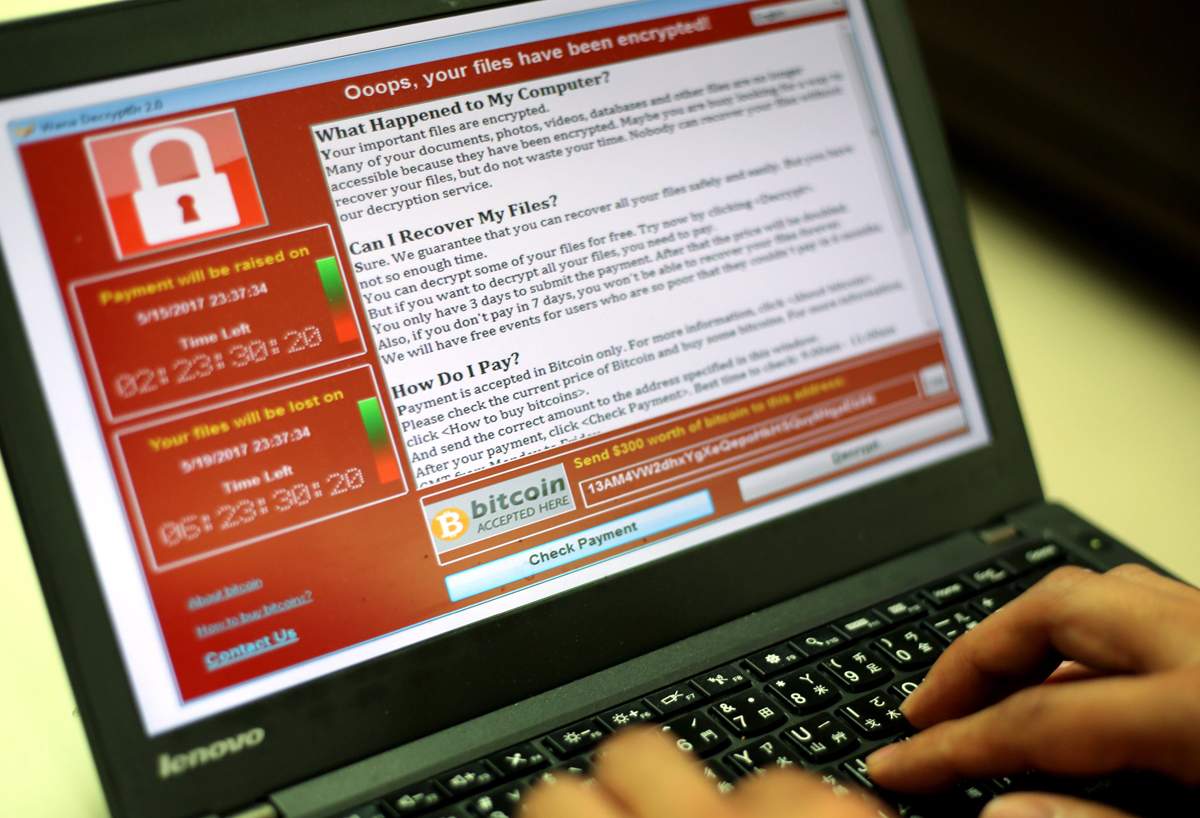 A programmer shows a sample of a ransomware cyberattack on a laptop in Taipei, Taiwan, 13 May, 2017. 