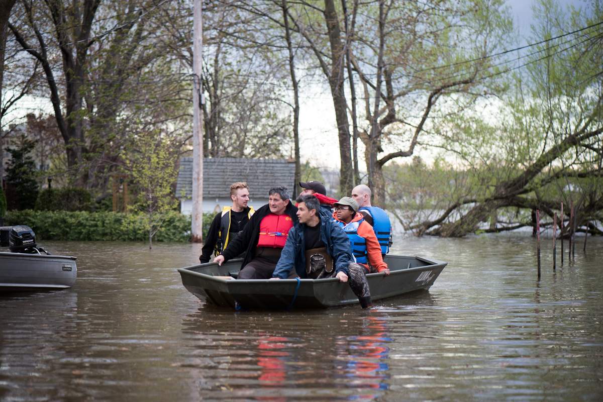 Volunteers help flood victims in Île Bizard in Montreal's West Island.