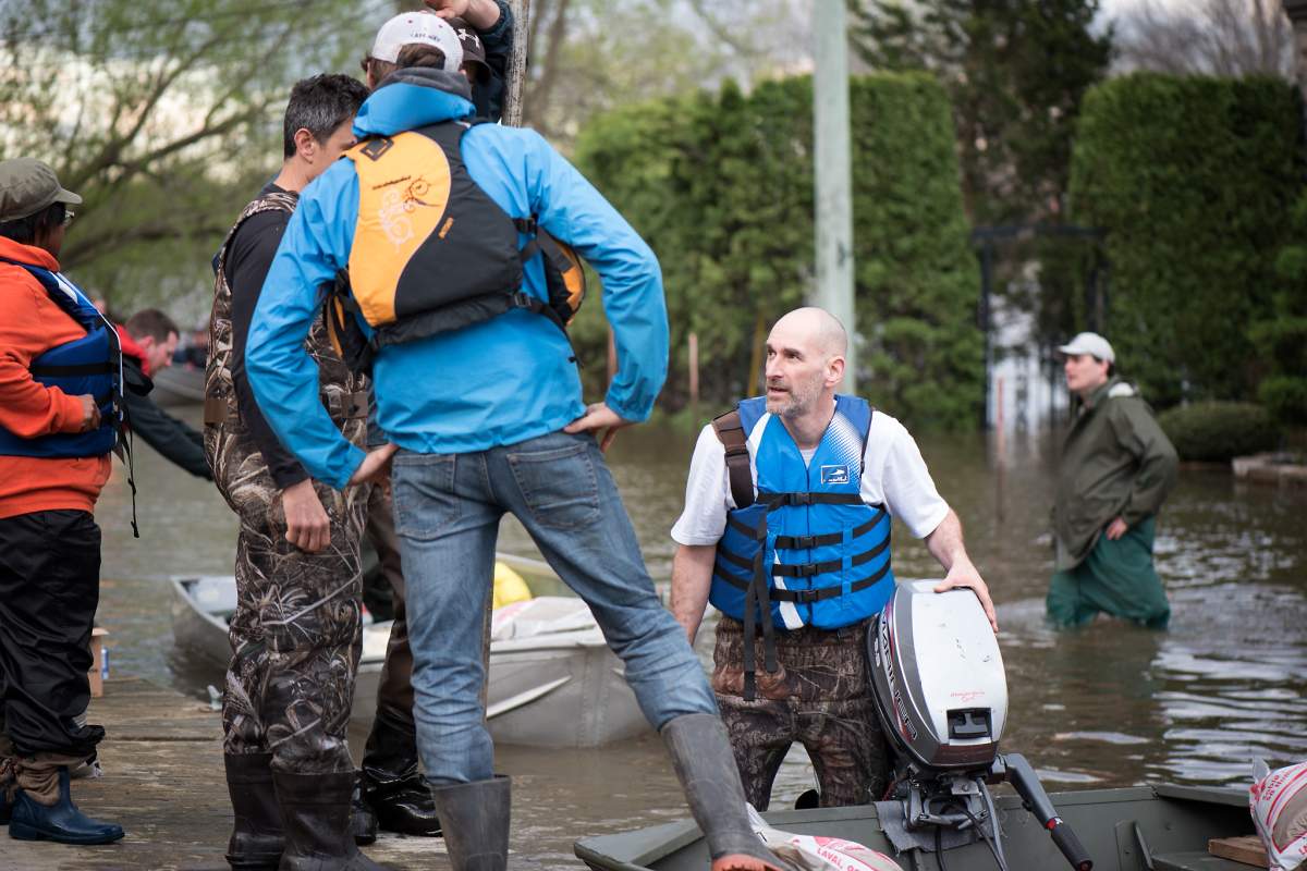 Volunteers help flood victims in Île Bizard in Montreal's West Island.