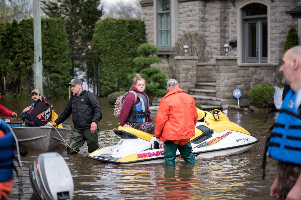 Volunteers help flood victims in Île Bizard in Montreal's West Island.