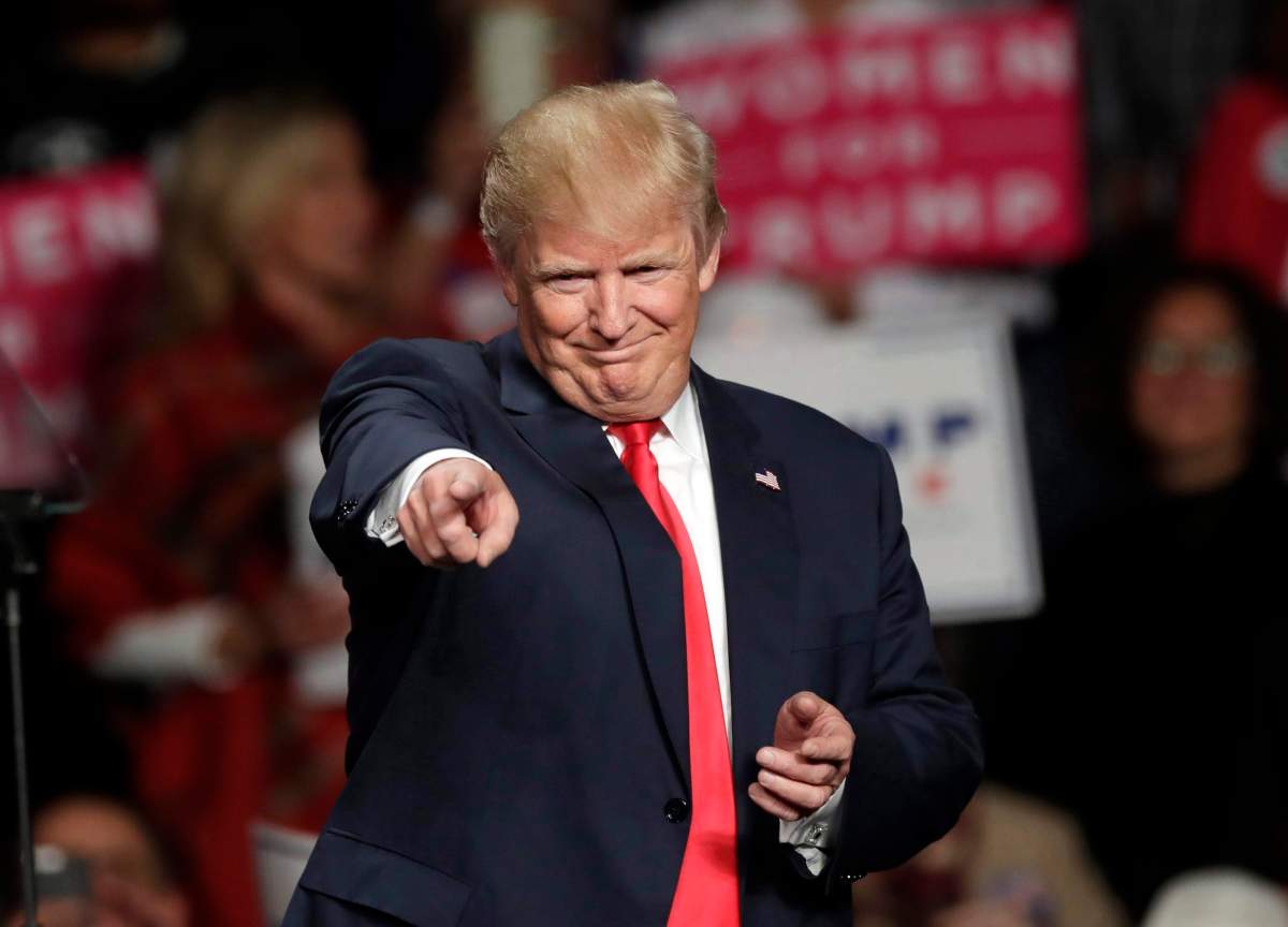 In this Oct. 31, 2016 file photo, then Republican presidential candidate Donald Trump acknowledges the crowd before speaking at Macomb Community College in Warren, Mich. 