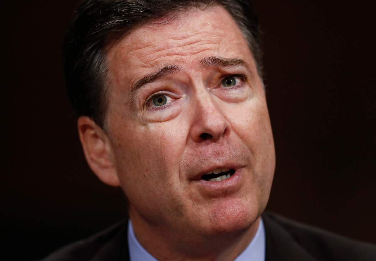 In this Wednesday, May 3, 2017 photo, then-FBI Director James Comey testifies on Capitol Hill in Washington, before a Senate Judiciary Committee hearing.  A nonprofit issues group is labeling James Comey a political "showboat" in an advertisement set to air on television Thursday, the day the former FBI director testifies on Capitol Hill.