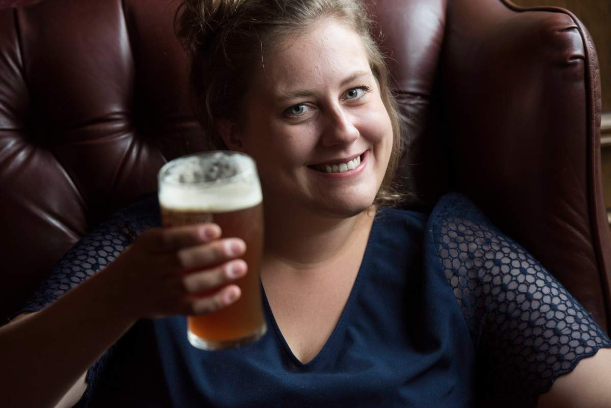 Meghan Harper enjoys a Maybee craft beer at James Joyce Pub in the Crowne Plaza Hotel in Fredericton, N.B., on Friday, June 16, 2017. The craft brewing industry is booming in Fredericton and officials in New Brunswick’s capital are hoping tourists will want to taste what the city has on tap.