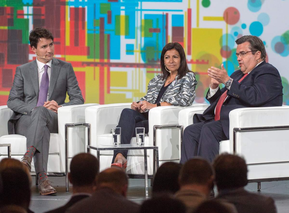 Prime Minister Justin Trudeau, left to right, Paris Mayor Anne Hidalgo and Montreal Mayor Denis Coderre take part in a discussion at the XII Metropolis World Congress Tuesday, June 20, 2017 in Montreal.
