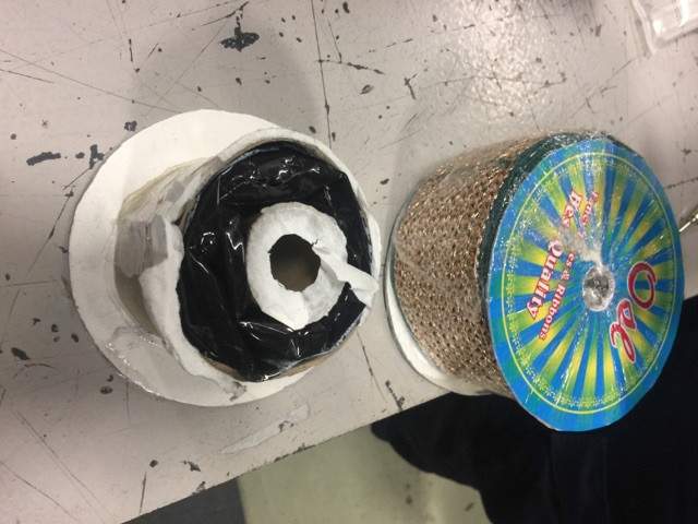 Police say they also found drugs inside spools of fabric. 