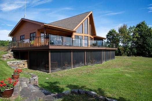 This 4,000-square-foot home features oversized windows that frame Washademoak Lake