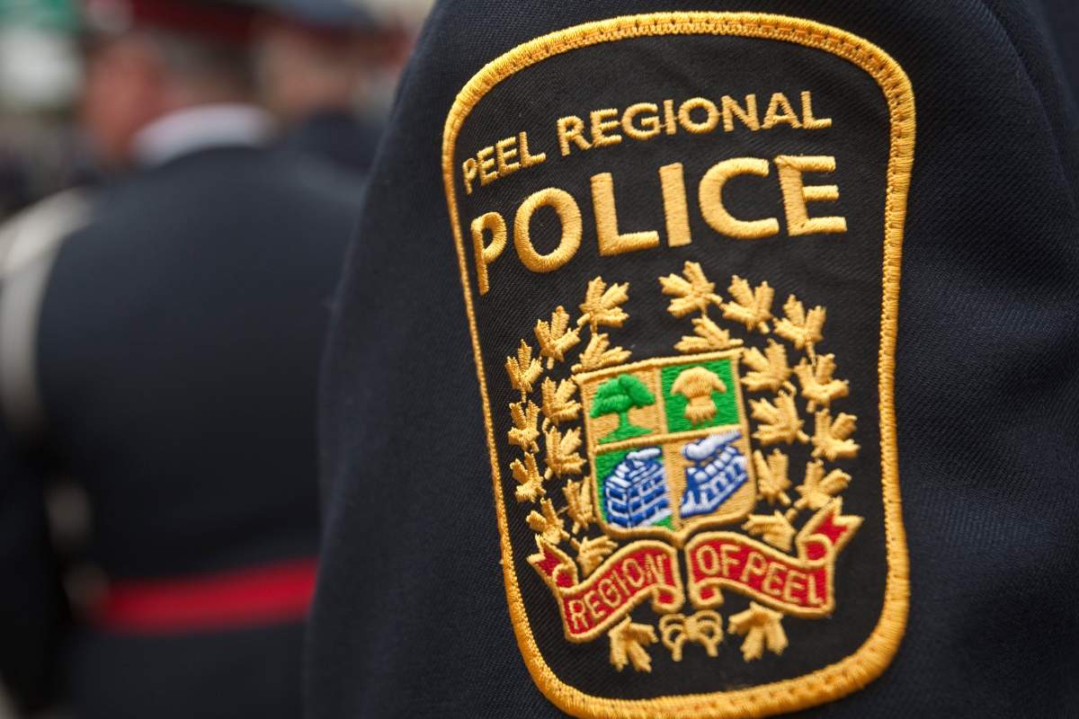 Peel Regional Police have laid charges against a doctor after a camera was found in a women's employee washroom. 