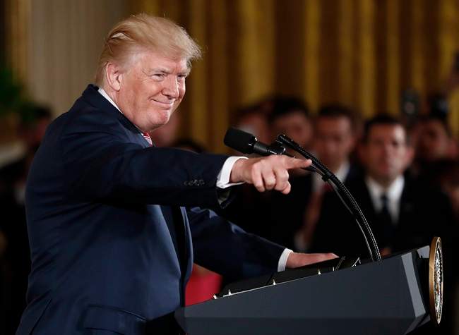 President Donald Trump points to the audience as he speaks in the East Room of the White House in Washington, Monday, June 5, 2017.