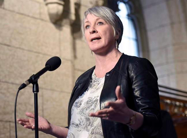 Federal Labour Minister Patty Hajdu speaks to reporters during a weekend meeting of the national caucus on Parliament Hill in Ottawa on Saturday, March 25, 2017. 