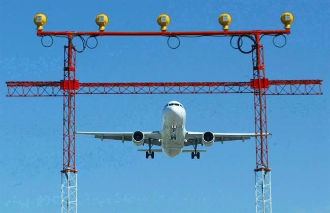 An airplane prepares to land at Pearson International Airport in Toronto, September 30, 2004.