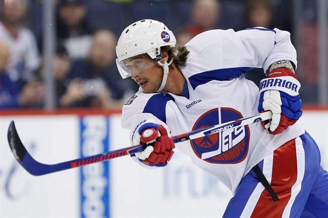 Former Winnipeg Jet Teemu Selanne takes a shot during a practice for the NHL's Heritage Classic Alumni game in Winnipeg on Friday, October 21, 2016.