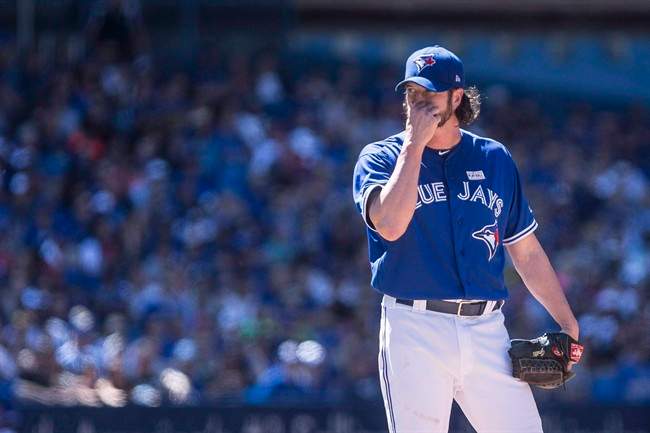 Toronto Blue Jays relief pitcher Jason Grilli reacts as he stands on the mound during eighth inning American League MLB baseball action against the New York Yankees in Toronto on Saturday, June 3, 2017. 