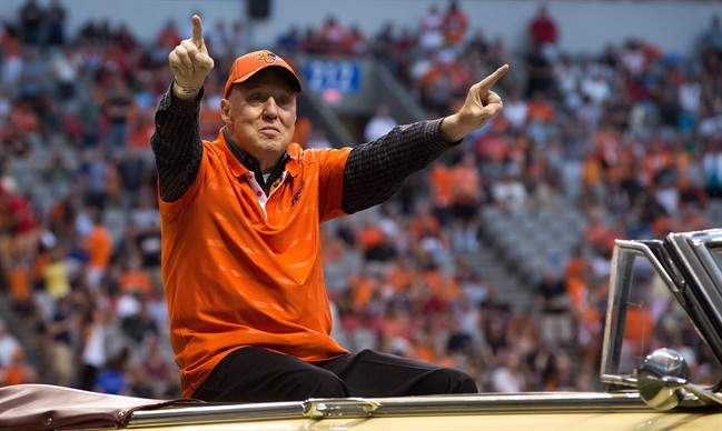 Former B.C. Lions head coach Don Matthews is driven onto the field to be inducted into the CFL football team's Wall of Fame during halftime of the team's game against the Edmonton Eskimos in Vancouver, B.C., on Saturday July 20, 2013. The Hall of Famer, who died Wednesday at the age of 77, was one of the most prolific coaches in CFL history with 231 wins and 10 Grey Cups on his resume.