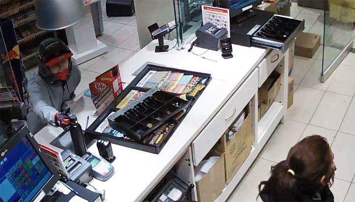Two women armed with a handgun and bear spray make off with cash, cigarettes in a Saskatoon armed robbery.