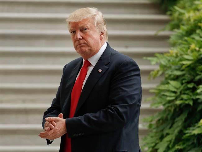 President Donald Trump walks back into the White House in Washington, Wednesday, June 7, 2017, following his arrival on Marine One helicopter.