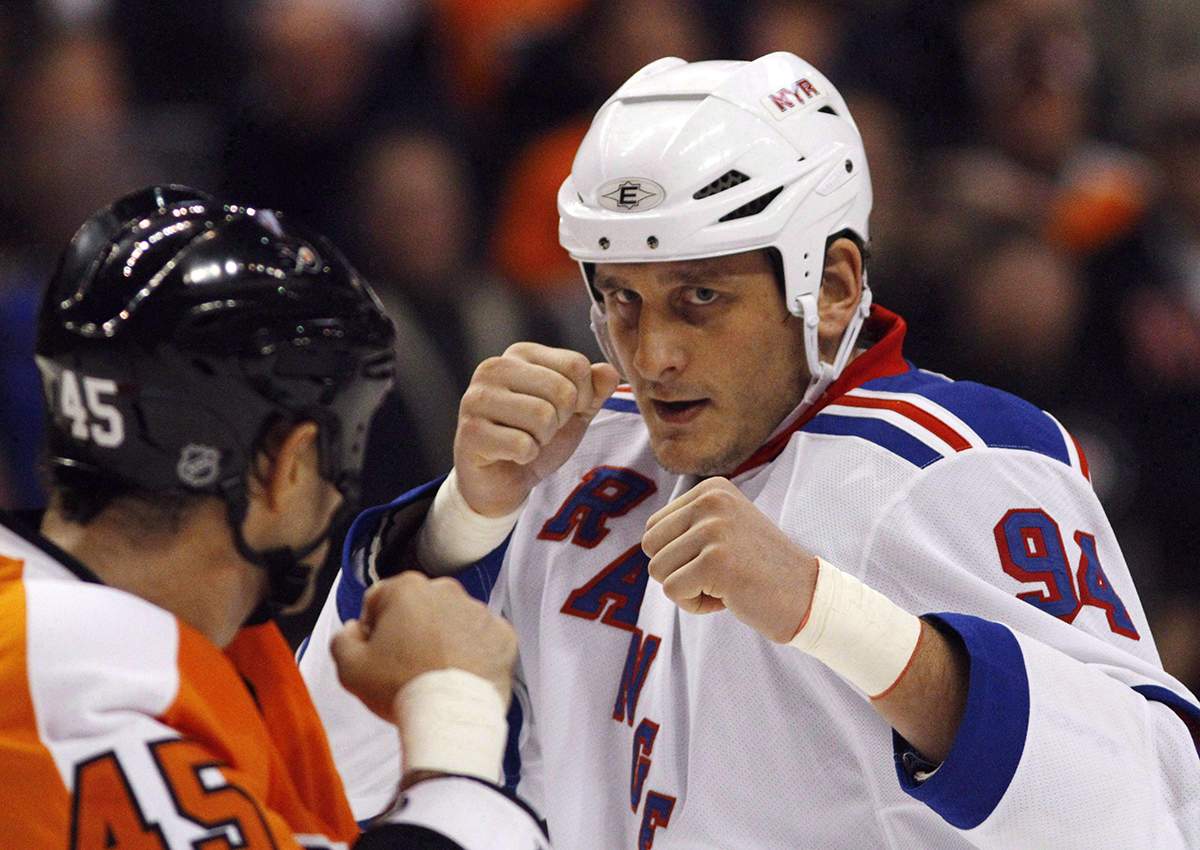 In this Nov. 4, 2010, file photo, Philadelphia Flyers' Jody Shelley, left, and New York Rangers' Derek Boogaard fight during an NHL hockey game in Philadelphia.