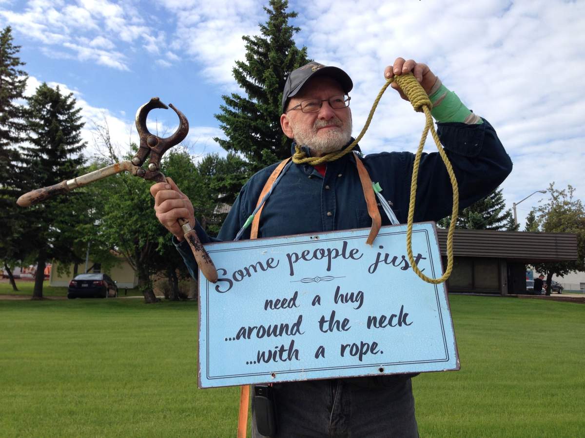 Allan Sutton stands outside the Evansburg Provincial Court building during a court appearance of a man accused of sexually assaulting his three daughters, Monday, June 12, 2017.