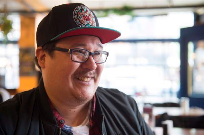 Indigenous poet Jordan Abel is shown during an interview with The Canadian Press in Toronto on Thursday, May 25, 2017. THE CANADIAN PRESS/Frank Gunn.