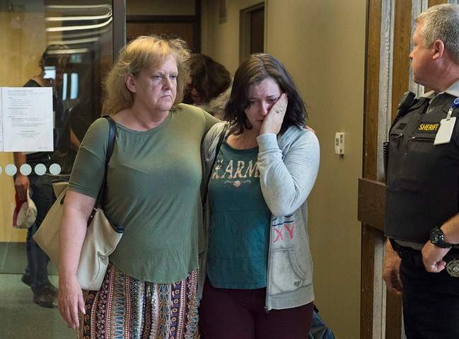 Taylor Samson’s mother, Linda Boutilier (left) and family friend Anne-Marie Anstey head from the courtroom at the murder trial of William Sandeson at Nova Scotia Supreme Court in Halifax on June 18, 2017. (Andrew Vaughan/Canadian Press)
