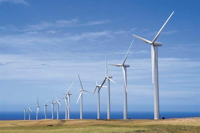 FILE - In this July 12, 2007, file photo, General Electric wind turbines, part of the Pakini Nui Wind Farm project are seen in Kailua-kona, Hawaii. 