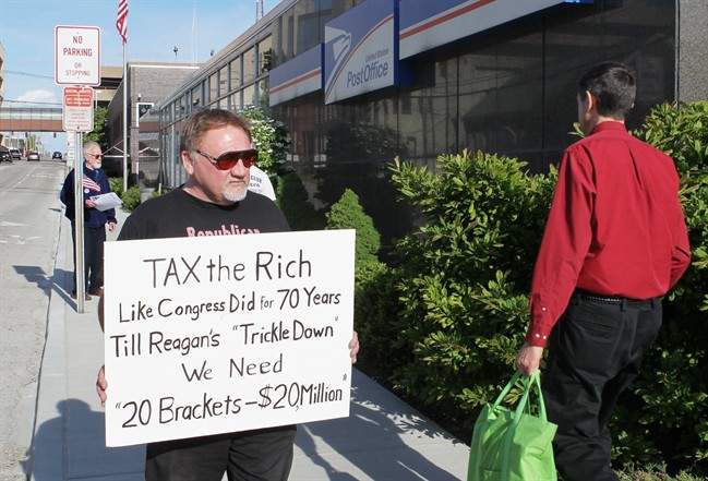 FILE - In this April 17, 2012, photo, James Hodgkinson of Belleville protests outside of the U.S. Post Office in Belleville, Ill. The suspect in the Virginia shooting that injured Rep. Steve Scalise and several others has been identified as Hodgkinson.