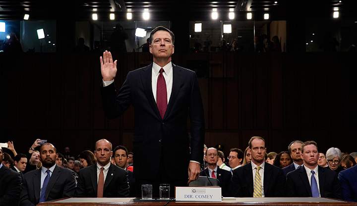 Former FBI Director James Comey is sworn in prior to testifying before a Senate Intelligence Committee hearing on Russia’s alleged interference in the 2016 U.S. presidential election on Capitol Hill in Washington, June 8, 2017.