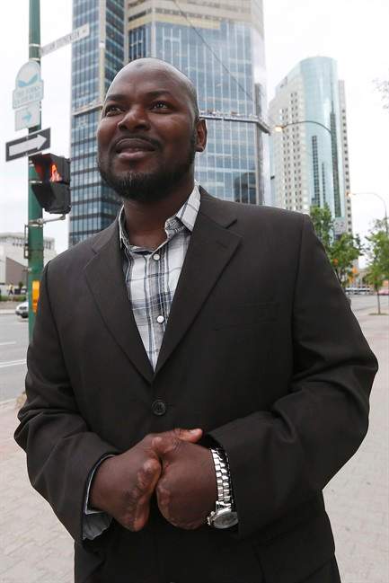 Razak Iyal, one of two asylum seekers who walked across the Canada/US border and lost his fingers and toes because of severe frostbite, is photographed.