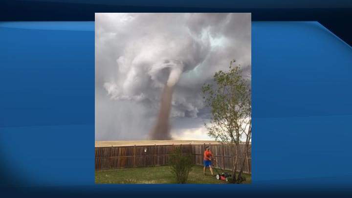 Cecilia Wessels snapped a picture of her husband, Theunis, on Friday, June 2, 2017 as a twister passed near their home in Three Hills, Alta.