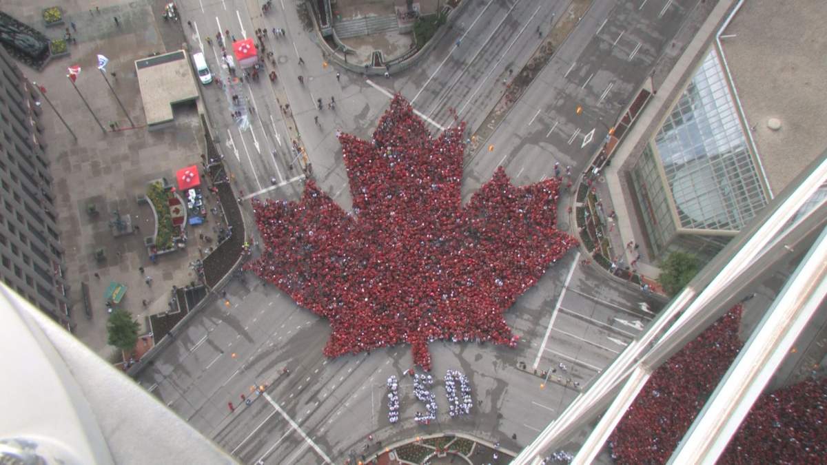 The living flag created Saturday morning at Winnipeg’s Portage and Main.