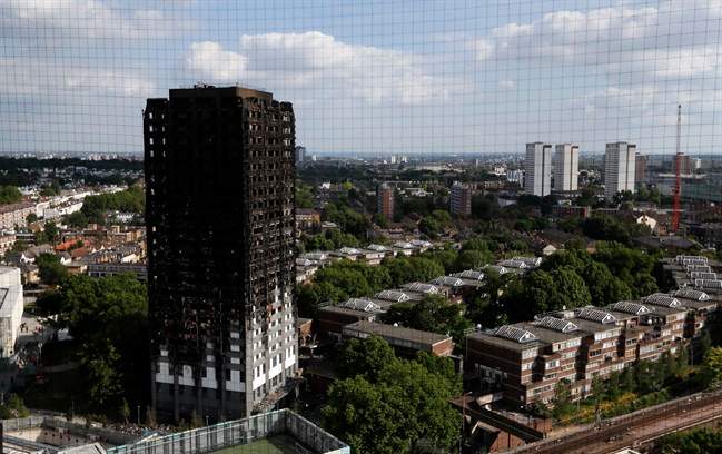 The remains of Grenfell Tower stand in London, Saturday, June 17, 2017. 