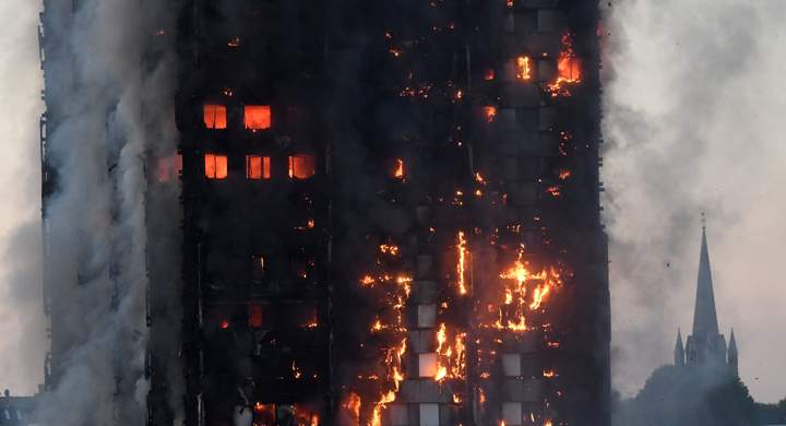 Flames and smoke engulf a tower block, in north Kensington, West London, Britain June 14, 2017.