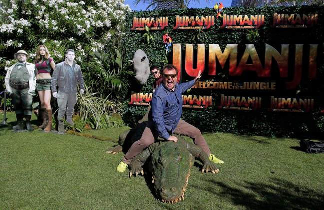 Actors Jack Black, right, and Nick Jonas pose to the media during a photocall to promote the film "Jumanji: Welcome to the jungle" in Barcelona, Spain, Sunday, June 18, 2017. 