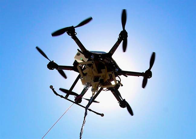 FILE - This Friday, Sept. 6, 2013, file photo shows a drone at a testing site in Lincoln, Neb. An experimental study in Sweden suggests drones equipped with heart defibrillators could help with response times for out-of-hospital cardiac arrest. Drones arrived at the scene of cardiac arrests almost 17 minutes faster on average than ambulances in a study in rural Sweden. 