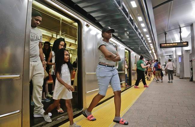 Passengers leave the No. 1 train at the South Ferry Station in New York City. A Canadian has pleaded guilty to plotting an attack on the city.