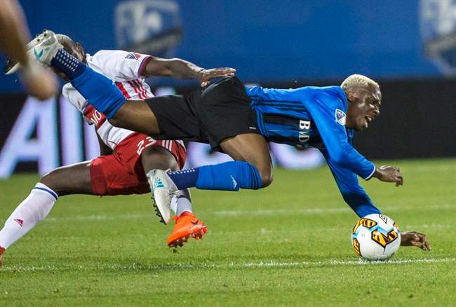 Montreal Impact midfielder Ballou Tabla, right, collides with Toronto FC defender Chris Mavinga during second half of the first leg of the Canadian Championship soccer final action, in Montreal on Wednesday, June 21, 2017.