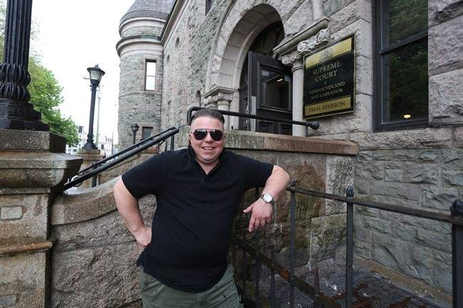 Gemma Hickey stands on the steps of the Supreme Court in St. John's NL on Friday on June 23 2017. Hickey a transgender activist vying for a non-binary birth certificate is taking legal action against the Newfoundland and Labrador government as part of a crusade to have genders other than male and female formally recognized.