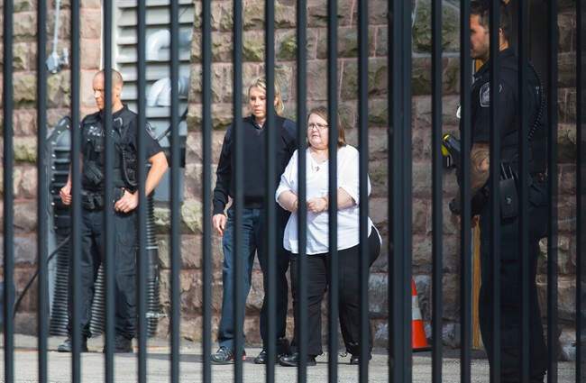 Elizabeth Wettlaufer is escorted from the Provincial courthouse in Woodstock, Ont., on Thursday, June 1, 2017.