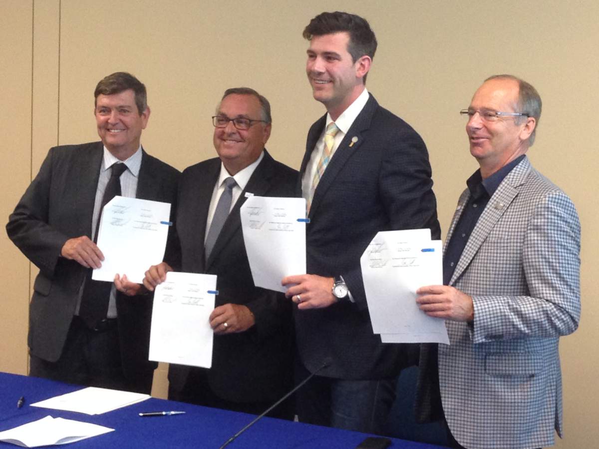 Edmonton International Airport president and CEO Tom Ruth, City of Leduc Mayor Greg Krischke, Leduc County Mayor John Whaley and Edmonton Mayor Don Iveson sign the annexation agreement June 30, 2017 between Edmonton and Leduc County.