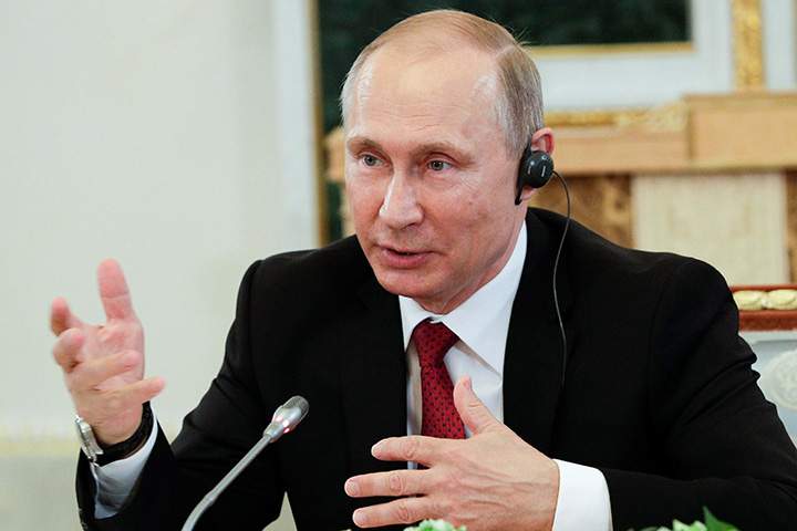 Russian President Vladimir Putin speaks during a meeting with representatives of international news agencies in St. Petersburg, Russia, June 1, 2017. 